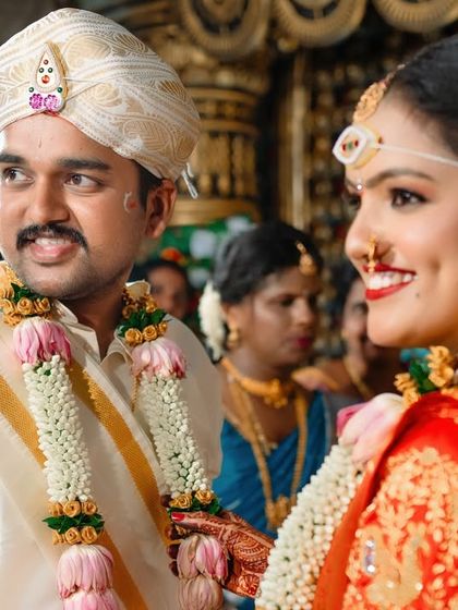 A candid shot of the bride and groom sharing a look during their wedding ceremony. We are always watching for these unposed, connecting moments.
