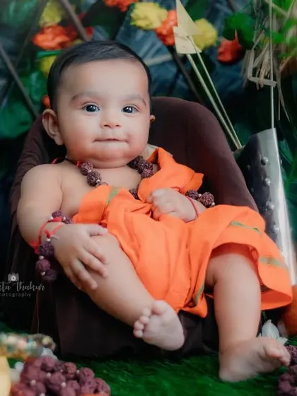A sweet and gentle portrait of this 4-month-old, dressed as Lord Ram for the holy occasion of Ram Navami.