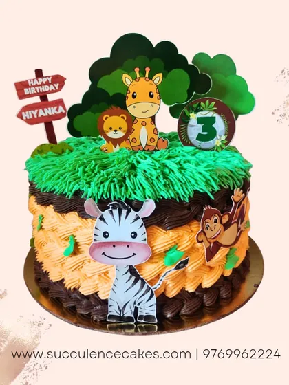 A wild jungle safari theme for a 3rd birthday. This cake features cute, friendly animal characters like a zebra, lion, and giraffe, with piped green grass and chocolate details to create a fun and inviting jungle scene.