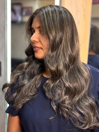 A profile shot of the creamy ash look, showing how the color complements her features.