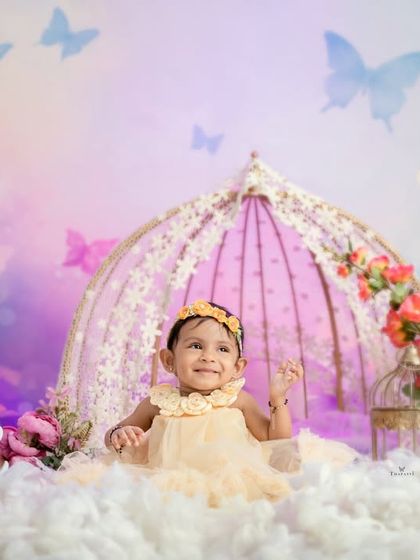 Another happy moment from the butterfly garden, showcasing the beautiful pastel backdrop and dreamy props.