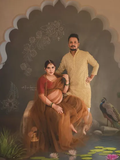 Celebrating the journey together. This painterly portrait features the couple in a setting inspired by Indian royalty, complete with a peacock and intricate architectural details. It shows how we can weave your shared story into a piece of fine art.