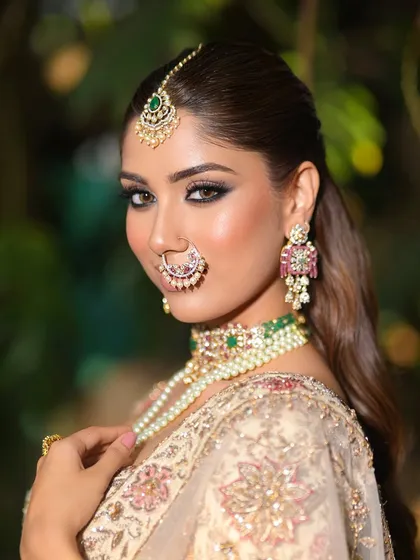 A striking close-up with a focus on the dramatic, smoky eye makeup. This look is perfect for a bride who wants to make a bold statement.