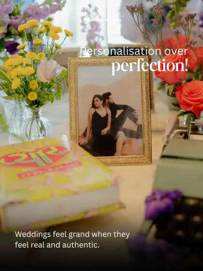 Personalization over perfection. A simple framed photo of the couple on a table adds a real and authentic touch that makes a wedding feel grand.