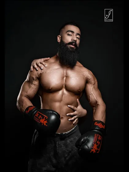 Another artistic shot from the boxing series, this one with a more contemplative expression. The lighting and composition create a high-fashion feel, suitable for editorial use or a unique portfolio piece.