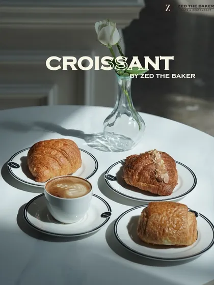 A quiet morning moment captured. My classic butter croissant, almond croissant, and pain au chocolat are served alongside a perfectly crafted cappuccino. Each pastry is a testament to the art of French viennoiserie.