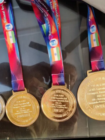 Gold and silver medals from the Senior National Championship. These are not just pieces of metal; they represent countless hours of brutal training and sacrifice.