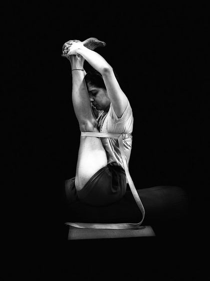A striking black and white photograph of a practitioner, embodying the focus and dedication required in the practice. The image reflects the principle that true knowledge comes to those who are humble and devoted.