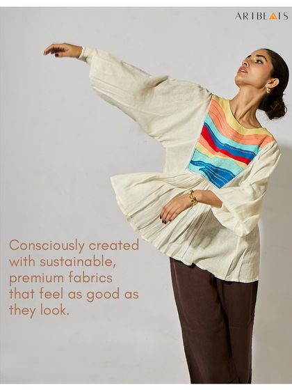 Art shouldn’t just hang on walls. It should live, breathe, and walk with you. This image of the Seascape Frill Top captures my core belief in creating clothing that lets you wear a story.