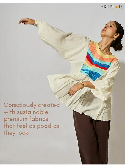 Art shouldn’t just hang on walls. It should live, breathe, and walk with you. This image of the Seascape Frill Top captures my core belief in creating clothing that lets you wear a story.