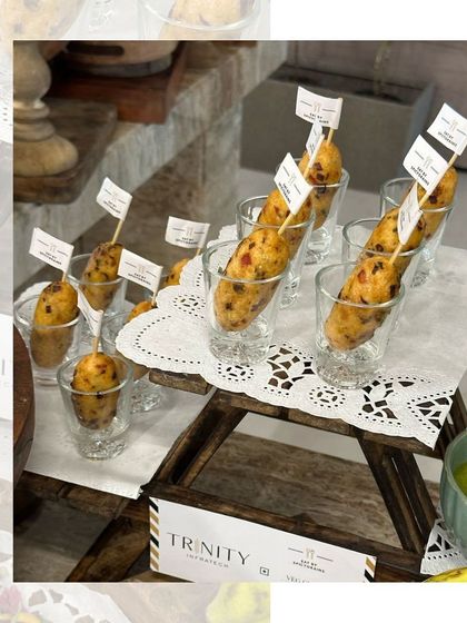 An assortment of appetizers served in shot glasses, a modern and elegant way to present small bites at any event.