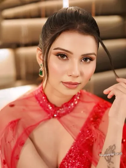 A close-up of the sophisticated cocktail look. We created a soft smokey eye and a neutral lip to balance the drama of the sparkling red gown.