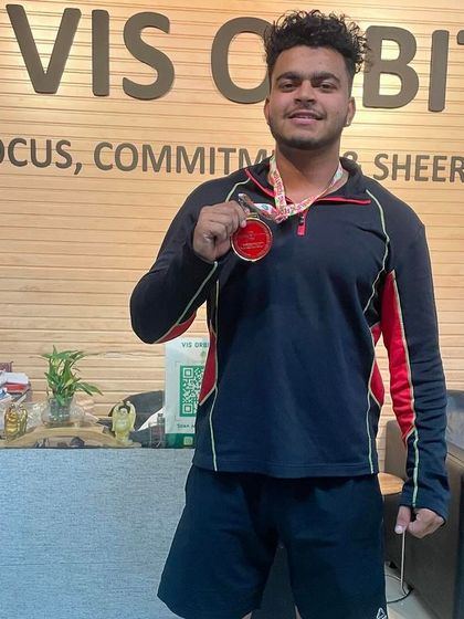 Another one of our strong athletes showing his medal from the national competition.