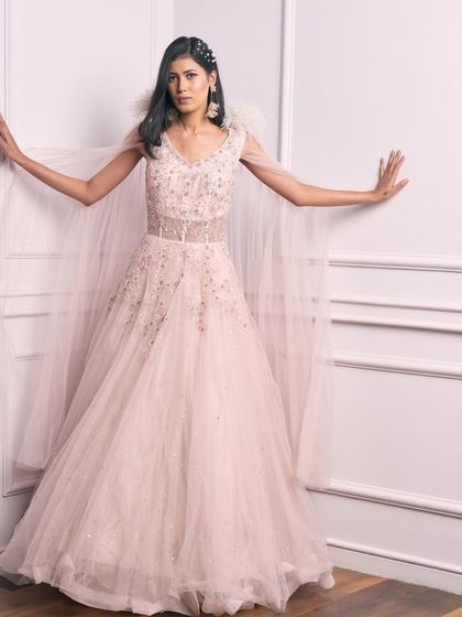 Another angle of our princess-style pale pink gown. The delicate embroidery and cape are simply beautiful.