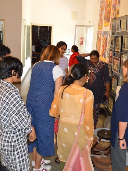The visiting team from MAP examining a display of film stills.