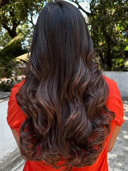 A simple highlight refresh can make a world of difference. I brightened up her existing color and gave her a fresh style, making her hair look vibrant and healthy again.