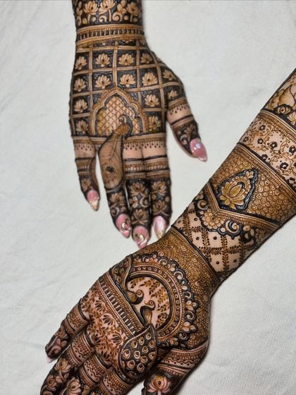 A different angle showing the beautiful combination of peacocks, lotuses, and geometric patterns.