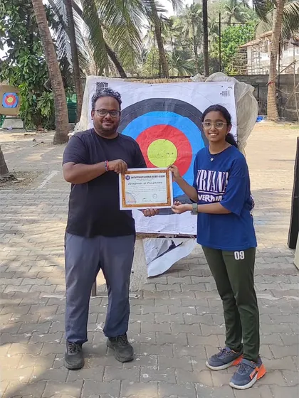 Presenting a certificate to a student from our 2023 Bandra summer camp. Our outdoor range provides a fantastic learning environment.