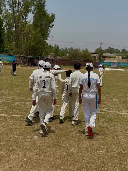 The team walking together, united in their goal.