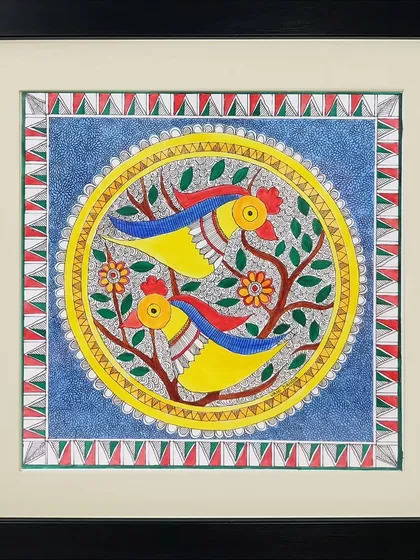 This Madhubani painting by Neha Kumari features two yellow birds in a tree. The circular composition and use of primary colors give it a bold and cheerful feel, typical of Mithila folk art.