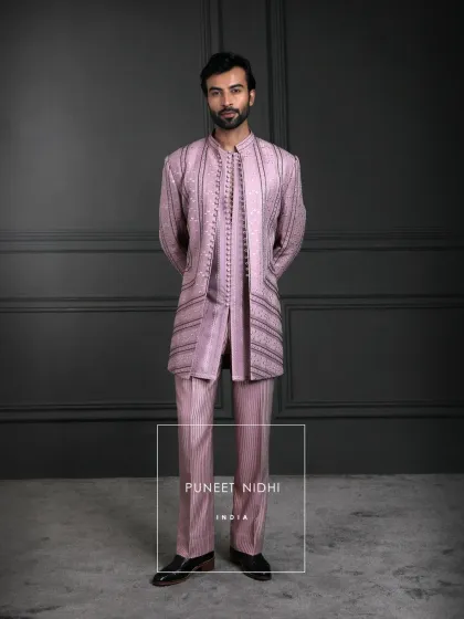 An ensemble that whispers royalty. Dusty salmon silk with a gentle sheen, woven stripes for depth, and fabric-covered loop buttons that carry the artistry of our timeless heritage.