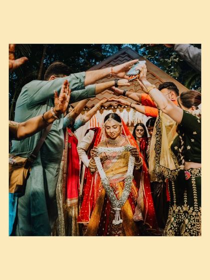 The bride's grand entrance under a canopy of hands, a beautiful tradition symbolizing the love and protection of her family.
