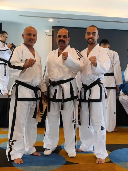 A photo with my master and another senior instructor. The lineage and mentorship in martial arts are deeply important to me.