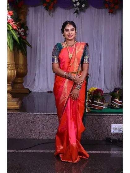 A full-length view of a wedding guest look. My service includes saree draping to ensure the pleats are perfect and the saree is comfortable to wear all day.