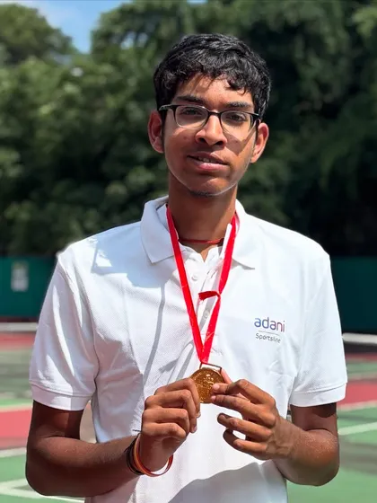 A close up on victory. This is the gold medal from the National Tennis Championship. For us, it represents more than a win; it's a symbol of breaking barriers and the culmination of countless hours of personalized, adaptive tennis training.