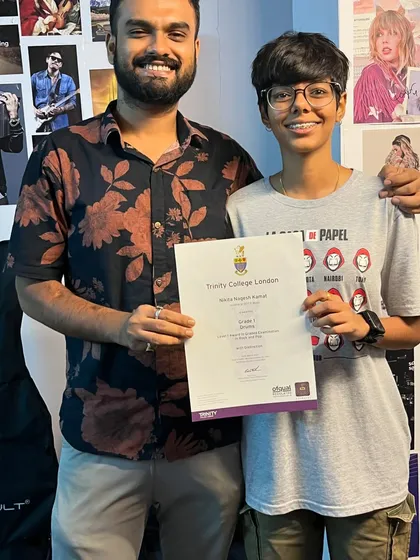 A happy student makes a happy teacher. Here I am with Nikita after she received her Grade 1 Drums certificate with Distinction from Trinity College.