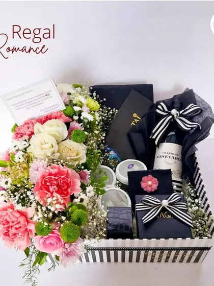 A full view of our "Regal Romance" hamper, presented in a stylish black and white striped box. It's the perfect sophisticated gift for a wedding or anniversary.