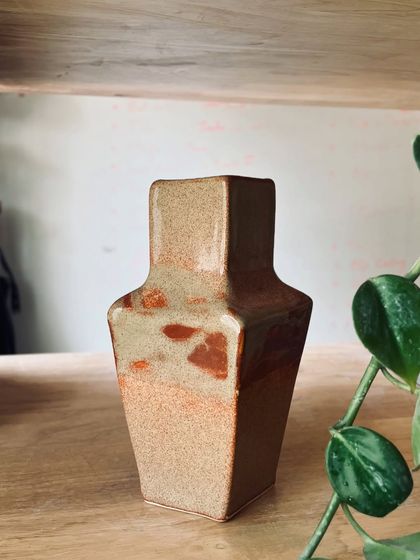 A square-based, hand-built vase with a lovely textured glaze, sitting pretty on our studio shelf.