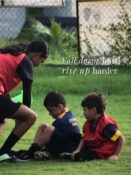 Fall down hard, rise up harder. This image of players helping each other up perfectly illustrates the resilience we build in our academy.
