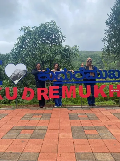 A group of trekkers posing at the "I Love Kudremukha" sign, a great spot to celebrate the start or end of this beautiful trek.