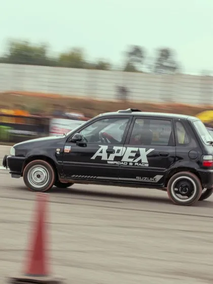 A black Suzuki Zen with "APEX" branding, another example of a modified hatchback built for the drag strip. These lightweight cars are often giant-killers.