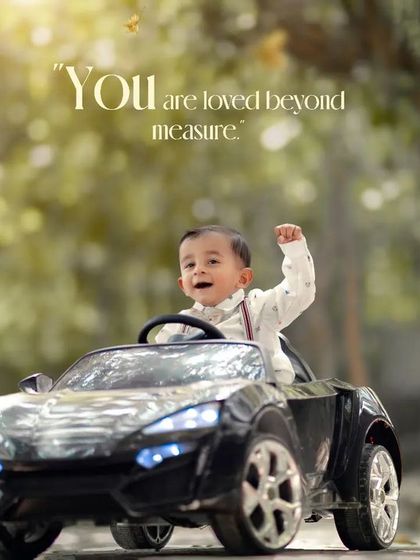 You are loved beyond measure. A triumphant and joyful boy celebrates in his toy car during an outdoor session.