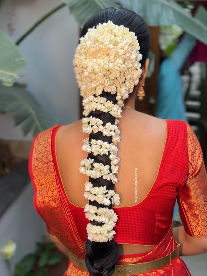 Another angle of the beautiful jasmine-covered braid, showing the fullness and fragrance of this timeless bridal hairstyle.