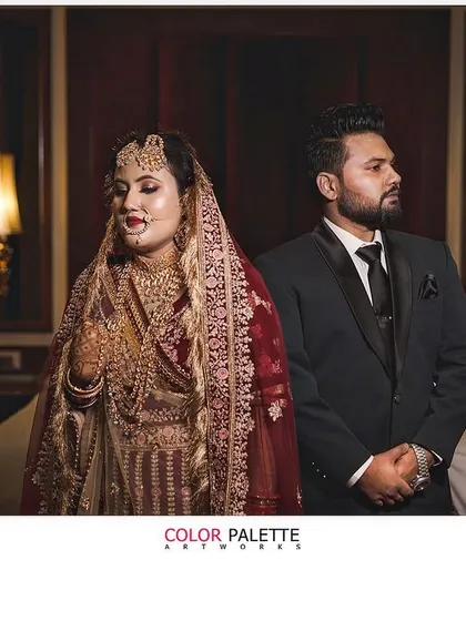 A stylish and moody portrait of a bride and groom. This showcases a more editorial approach to wedding photography, creating a dramatic and memorable image.