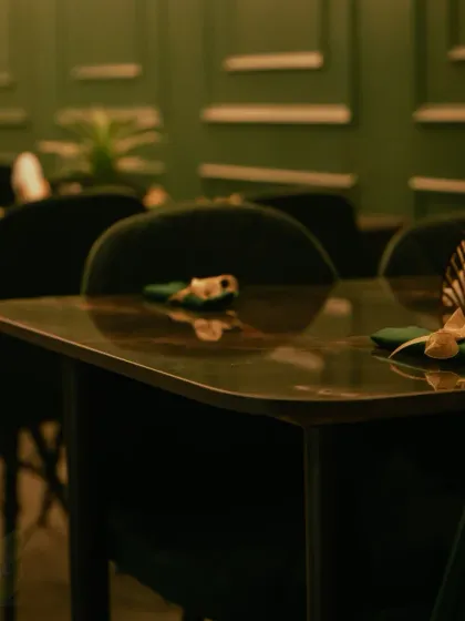 A close-up of the table top, reflecting the warm ambiance of the space.