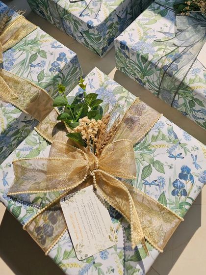 Another angle of the custom-wrapped gift, showing the full, beautiful bow and the personalized tag. It’s these finishing touches that truly elevate a gift.