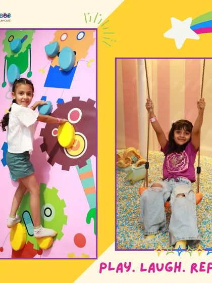 Play, laugh, repeat. A snapshot of kids enjoying the climbing wall and the swing.