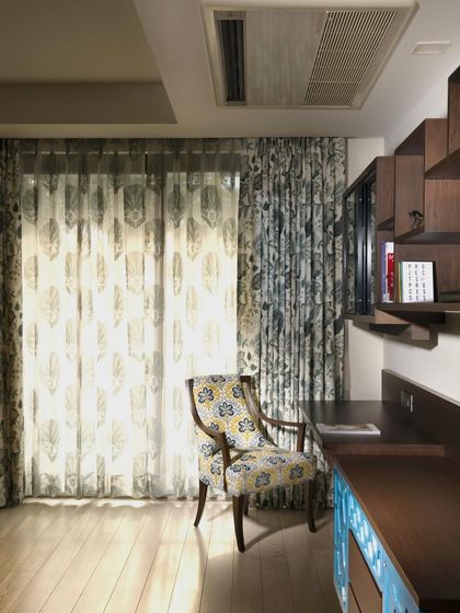 The study table at Casa K fits effortlessly into the bedroom, with clean lines and a pop of yellow in the drawers for refreshing energy. The cantilevered design and wooden side units create a functional environment that encourages both focus and inspiration.