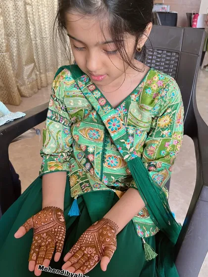 A cute little client getting her mehendi done. It's always a joy to apply mehendi on tiny hands.