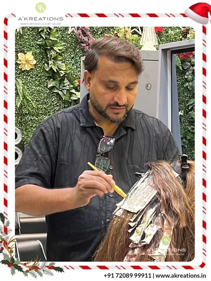 Creative Art Director Alam meticulously applies color with foils, demonstrating the precision and artistry that goes into every hair highlight service we provide.