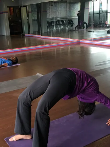 A practitioner in Urdhva Dhanurasana (Wheel Pose). This photo was taken seven years ago when the shala first opened. It has since become an anchor in my life, a space where people from all walks of life can come to practice.