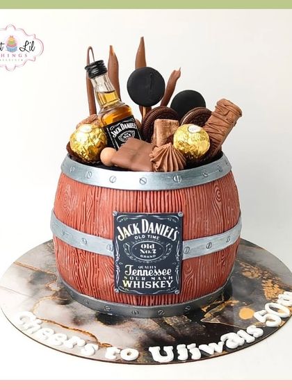 Cheers to 50 years! A Jack Daniel's whiskey barrel cake, overflowing with Ferrero Rocher and other chocolate treats.