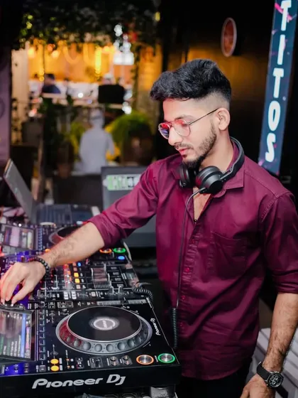 Focused on the Pioneer DJ gear during a throwback set. Precision and practice are the foundation of every performance.
