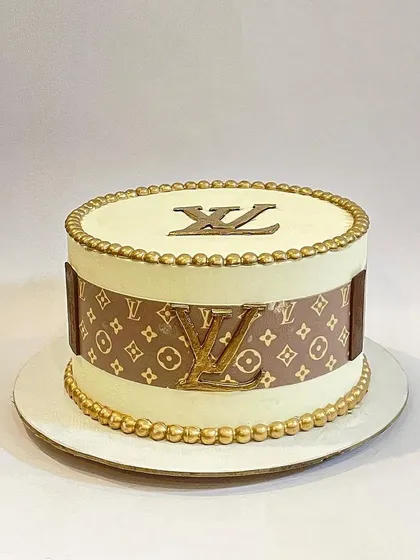 For the fashion lover, this Louis Vuitton inspired cake is the ultimate luxury statement. It features an edible print of the iconic monogram and a gold LV logo, all on a cleanly finished buttercream cake.