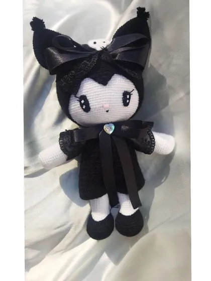 Another photo of the handmade Kuromi doll against a different background, highlighting her gothic-cute style.