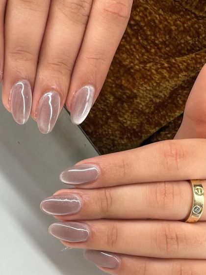 Another view of the glossy, translucent jelly nails. This style is all about enhancing the natural nail with a high-shine, dimensional finish.